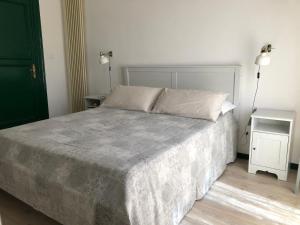 Postel nebo postele na pokoji v ubytování Cosmopolitan Palermo