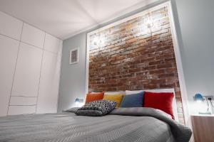 Posteľ alebo postele v izbe v ubytovaní Sherlock Apartment