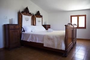 A bed or beds in a room at Nonna Maria