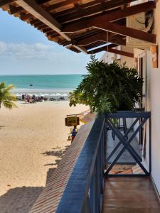 a view of the beach from the balcony of a building at Vila Gallina Pousada in Jericoacoara