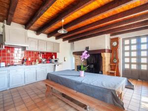 een keuken met een groot bed in een kamer bij Holiday home with private pool in Loub jac in Loubejac