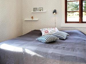Postel nebo postele na pokoji v ubytování Holiday home SKILLINGARYD