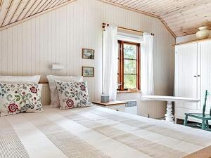 Postel nebo postele na pokoji v ubytování Holiday home SKILLINGARYD
