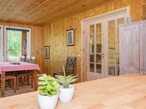 a kitchen with a table and a dining room at 6 person holiday home in Glesborg in Glesborg