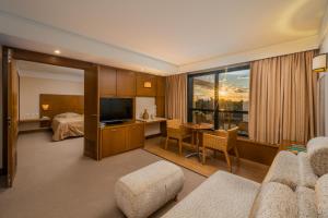 Uma TV ou centro de entretenimento em Blue Tree Towers Caxias do Sul