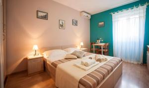 Postel nebo postele na pokoji v ubytování Miriam Rooms Zadar