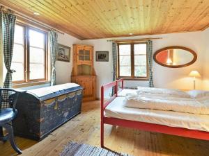 a bedroom with a bed and a wooden ceiling at 4 person holiday home in HALLABRO in Hallabro
