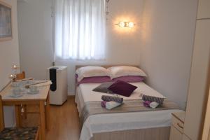 Postel nebo postele na pokoji v ubytování Miriam Rooms Zadar