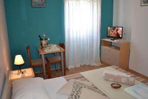 Postel nebo postele na pokoji v ubytování Miriam Rooms Zadar