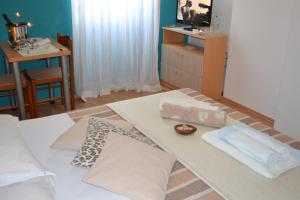 Postel nebo postele na pokoji v ubytování Miriam Rooms Zadar