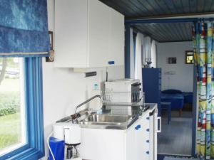 a kitchen with a sink and a window at One-Bedroom Holiday home in Stenungsund in Stenungsund