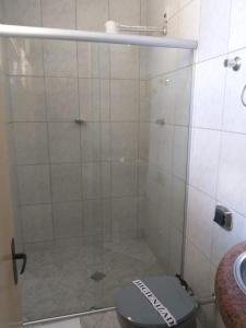 a bathroom with a shower with a toilet at HOTEL CANTO DO CHAFARIZ in Diamantina