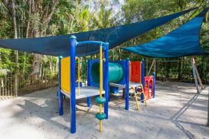 a playground with a blue tarp on top of it at BreakFree Aanuka Beach Resort in Coffs Harbour