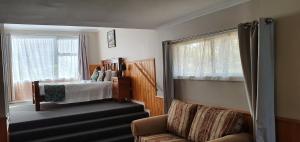 Postel nebo postele na pokoji v ubytování Cradle Alpine Retreat