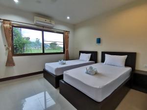 Postel nebo postele na pokoji v ubytování Nestvilla Khok-kloi Phang-nga + 14 fotografií