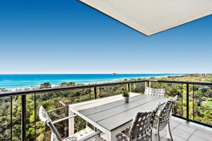 a view from a balcony of a beach with a view of the ocean at San Marino by the Sea Apartments in Marcoola