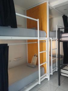 a group of bunk beds in a room at Wayang BnB in Yogyakarta