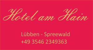 a red sign with the words hotel am inn at Hotel am Hain in Lübben