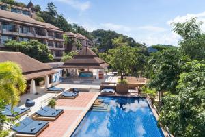 an aerial view of a hotel with a pool and lounge chairs at Avani Ao Nang Cliff Krabi Resort in Ao Nang Beach