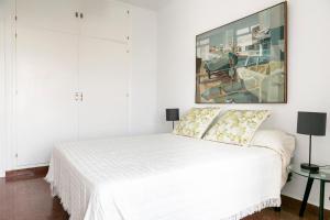 Posteľ alebo postele v izbe v ubytovaní Alameda Principal FreshApartments