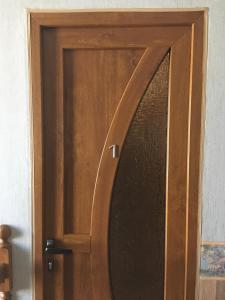 a wooden door with a window on it at Don-Antonio in Krasnodar