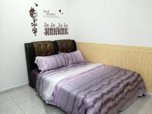 Postel nebo postele na pokoji v ubytování SKYHOMESTAY TELOK PANGLIMA GARANG