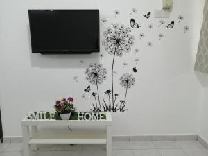 TV a/nebo společenská místnost v ubytování SKYHOMESTAY TELOK PANGLIMA GARANG
