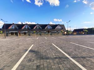 a parking lot in front of a building at BABIOGÓRSKA B&B in Zubrzyca Górna