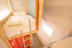 Postel nebo postele na pokoji v ubytování Theatel Sapporo