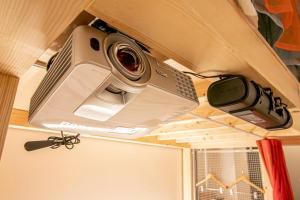 two cameras are hanging from the ceiling of a room at Theatel Sapporo in Sapporo