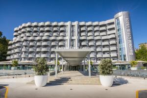 a building with white pots in front of it at Barceló Costa Vasca in San Sebastián