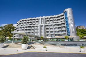 a large white building with a sign on it at Barceló Costa Vasca in San Sebastián
