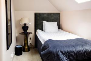 Postel nebo postele na pokoji v ubytování Hotell Visby Börs