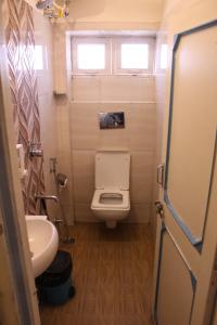 a small bathroom with a toilet and a sink at Moustache Jodhpur in Jodhpur