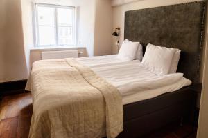 Postel nebo postele na pokoji v ubytování Hotell Visby Börs
