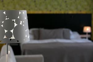 Posteľ alebo postele v izbe v ubytovaní Art Hotel Szeged