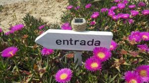 a sign in a field of purple flowers at Casa Miralejos in Lliber