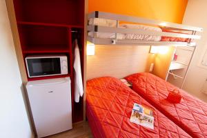 Postel nebo postele na pokoji v ubytování Premiere Classe Valence - Bourg Les Valence