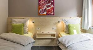Postel nebo postele na pokoji v ubytování B&B Alte Sägemühle Schlommefurth