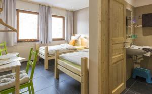 Postel nebo postele na pokoji v ubytování B&B Alte Sägemühle Schlommefurth