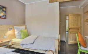 Postel nebo postele na pokoji v ubytování B&B Alte Sägemühle Schlommefurth