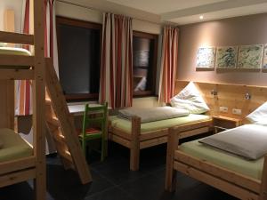Postel nebo postele na pokoji v ubytování B&B Alte Sägemühle Schlommefurth