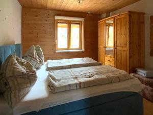 Ένα ή περισσότερα κρεβάτια σε δωμάτιο στο CHALET DORFER