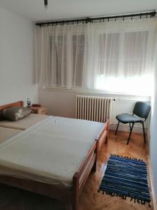 Ліжко або ліжка в номері Apartman KIKA