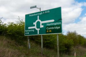 a green sign on the side of a road at Chestnut Court in Wellingborough