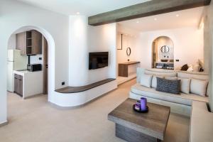 a living room with a couch and a table at Gonia Residences in Pirgos