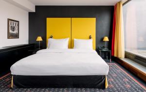 Ein Bett oder Betten in einem Zimmer der Unterkunft OREA Hotel Angelo Praha