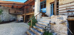 a set of stone stairs leading to a house at Casa do Polo A Vilerma Ribeira Sacra in Sober