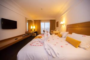 Ένα ή περισσότερα κρεβάτια σε δωμάτιο στο Hotel Timoulay and Spa Agadir