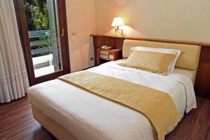 Postel nebo postele na pokoji v ubytování Hotel Bellavista
